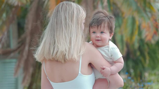 Caucasian mom and son hanging out at park