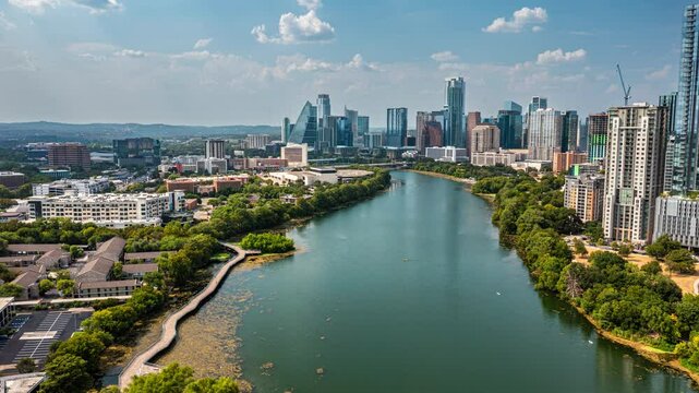 4K+ Aerial time-lapse over Lady Bird Lake with downtown Austin skyscrapers