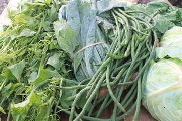 Assorted vegetables on wooden table

