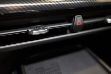 Closeup of car dashboard air vents near gear shift