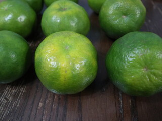 fresh food background of  green tangerines design for healthy diet