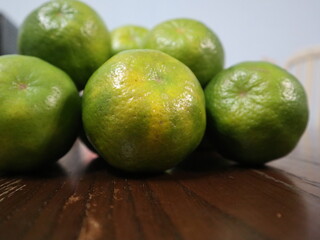 fresh food background of  green tangerines design for healthy diet