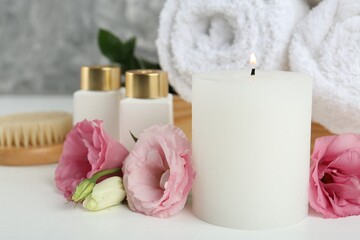 Composition with different spa supplies on white table, closeup