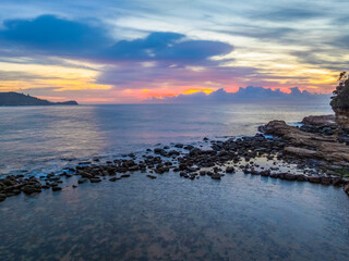 Obraz premium Aerial Sunrise Seascape Shrouded in Fog and High Clouds