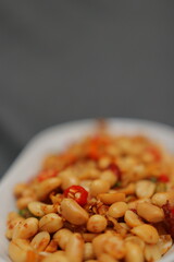 Nuts and spices chili and onion on black background for product, educational and other purposes