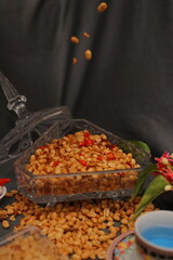 Nuts and spices chili and onion on black background for product, educational and other purposes