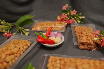 Nuts and spices chili and onion on black background for product, educational and other purposes