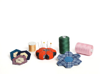 Quilting accessaries and quilt blocks for making a hexagon handmade blanket. 