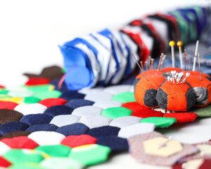 Quilting accessaries and quilt blocks for making a hexagon handmade blanket.