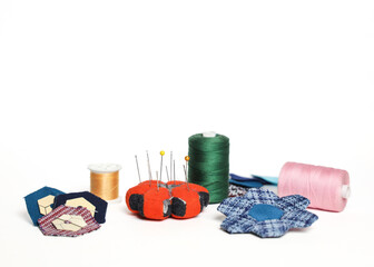 Quilting accessaries and quilt blocks for making a hexagon handmade blanket.