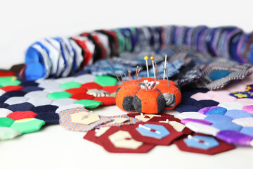 Quilting accessaries and quilt blocks for making a hexagon handmade blanket.