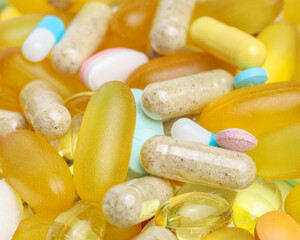 Close up of colorful medicine pills and capsules. Background made from colorful pills and capsules.