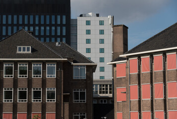 Mix of traditional and modern buildings between campus and Amstel