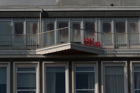 Triangle shaped balcony in front of hotel gallery in East Amsterdam near Magere Brug