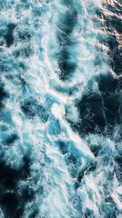 Fototapeta premium Aerial View of Turquoise Ocean Waves Creating Beautiful Patterns in the Water