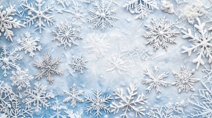 Winter wonderland snowflake background featuring various intricate snowflake designs on a frosty white and blue backdrop.
