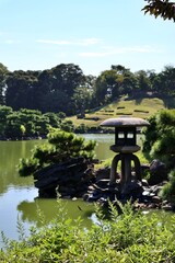 Dai-Sensui Pond and Japanese black pine trees in Kiyosumi Garden, Tokyo, Japan