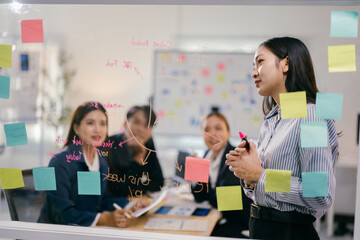 Team of asian businesspeople are having a creative brainstorming meeting in their office conference...