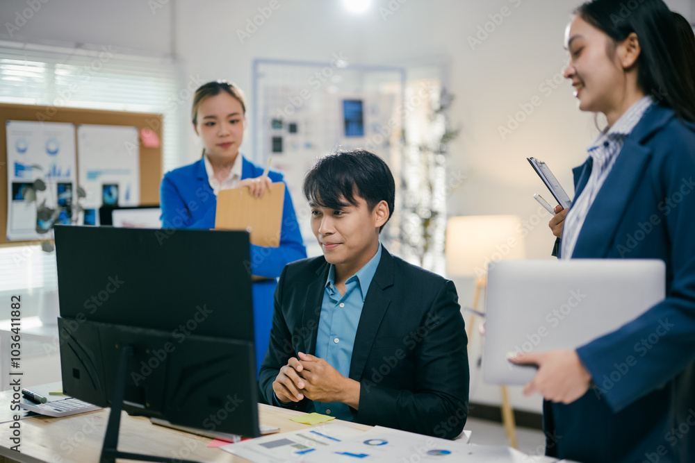 Aufkleber diverse team of asian businesspeople in a modern office. engaged in a lively meeting using a compute