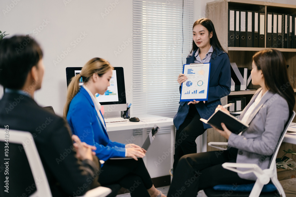Aufkleber diverse asian business team brainstorming in a modern office, discussing strategies for success with