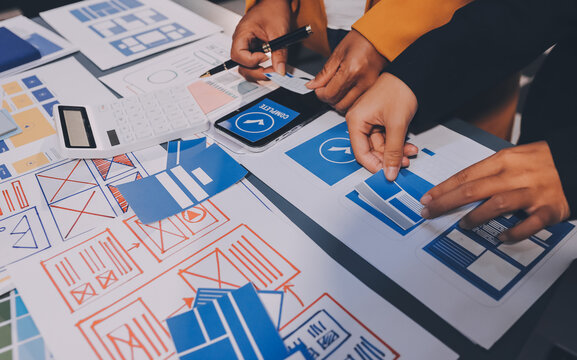 The designer team is designing the uxui system to make the uxui system work well on new phones and support system updates. Website development concept UI UX front end designer