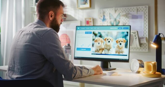 Adult man types prompt in AI video generator on PC. Online artificial intelligence software generates detailed video of three puppies. From text prompt to realistic generated video. Automated artwork.