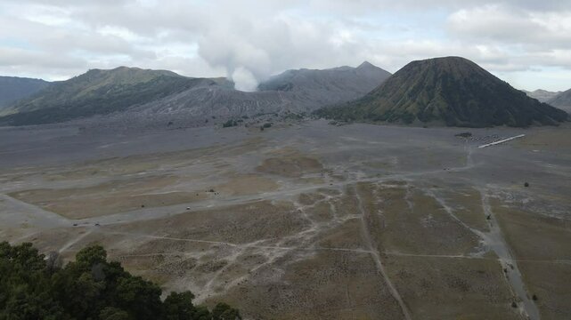View of Mount Bromo and Mount Batok seen from a height. Bromo Tengger Semeru National Park is a very famous natural tourist area located in Probolinggo, East Java, Indonesia.