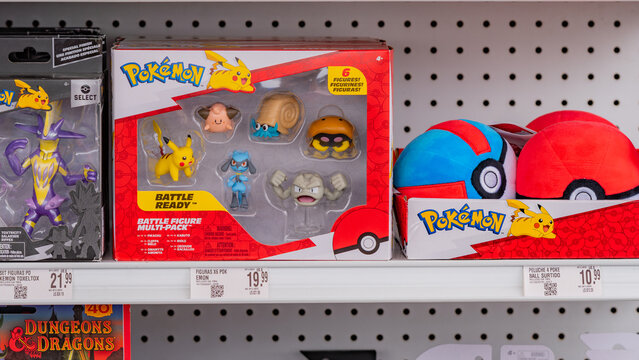 Budokan Geek Convention In GUAYAQUIL, ECUADOR - 
OCT 13, 2024 - Pokemon battle figure multi-pack and plush pokeballs on a store shelf. Iconic collectible toys for Pokemon fans, featuring Pikachu
