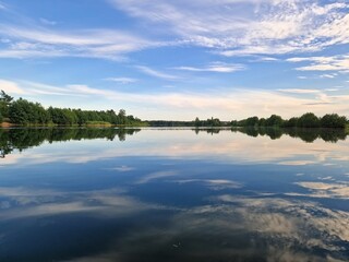 Scenic view of Scharmutzelsee with lush greenery along the shore