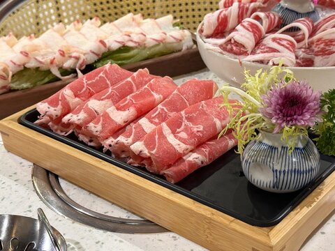 beef roll for hot pot, fresh sliced raw beef, meat roll, wooden plate