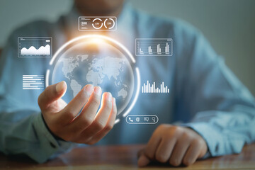 A man is holding a globe in his hand