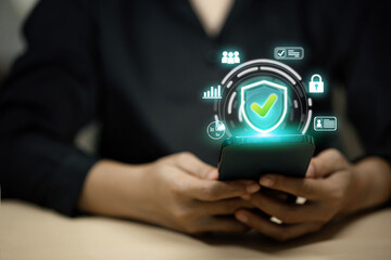 A person is holding a cell phone with a green check mark on it