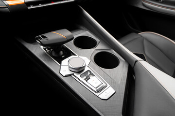 Automatic gear in car. Modern car interior details. Close up view. Automatic transmission lever...
