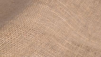 Jute hessian burlap. Brown sackcloth woven texture background in natural pattern.