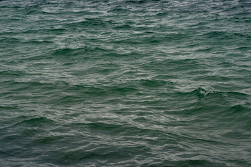 Textural waves at sunset in the sea