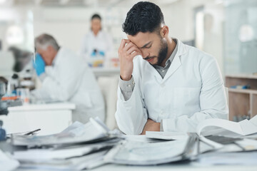 Science, stress and man in laboratory with documents for medical analysis, research and study. Healthcare, biotechnology and scientist with paperwork for burnout, fatigue and frustrated at desk