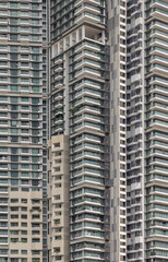 Fototapeta premium Architectural exterior of condominium building facade. Frame and glass windows architecture, Space for text, Selective focus.