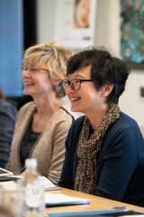 Diverse Group of Professionals Engaged in a Meeting, Smiling and Collaborating in a Modern Office Environment