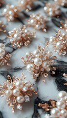 Fototapeta premium Golden jewelry with pearls on marble. A close up photo of pearl jewelry that features a gold base with pearl accents and intricate detailing.