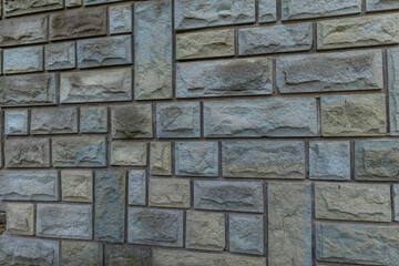 Gray stone tiles on the wall of a building