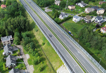 Vehicles Moving Along Roadside Barrier