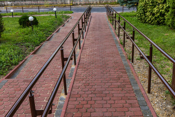 A red cobblestone driveway for disabled people
