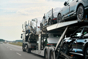 Naklejka premium Two-level car hauler with new SUVs