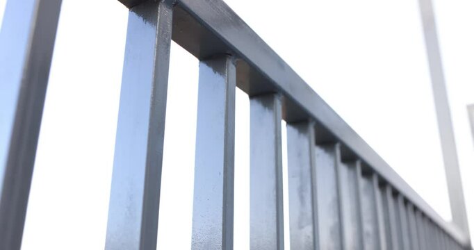 Gray steel metal fence on a balcony or terrace