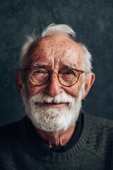 Portrait of a Smiling Elderly Man with Glasses and White Beard Against a Dark Background