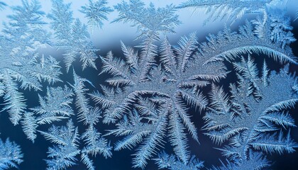 A close-up view of frost forming on a windowpane during winter reveals its crystal-like texture and intricate patterns.