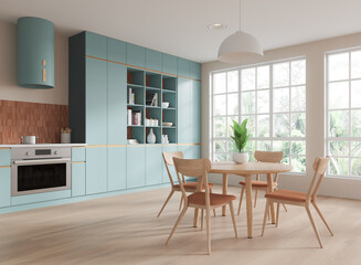 Home kitchen interior with dinner table and cooking cabinet. Panoramic window