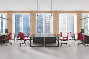 Modern office interior with desks and red chairs in a bright space. 3D Rendering