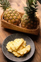pineapple slices on a white ceramic plate. Ananas comosus. tropical fruit.