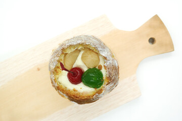 cream puff or choux pastry filled with cherries isolated on white background